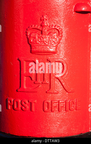 Close up of traditional red Royal Mail Post Office pillar box from Queen Elizabeth the second, UK Stock Photo
