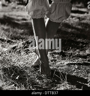 Caucasian girl walking outdoors Stock Photo