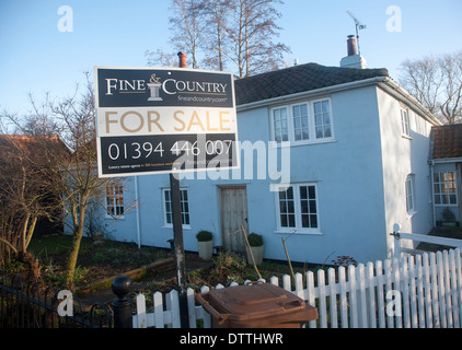 Fine and Country estate agent for sale sign outside detached rural house, Suffolk, England Stock Photo