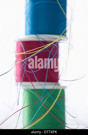 Close up of three thread spools, isolated on white background Stock ...