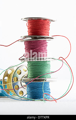 Stacks of spools of multicolor thread Stock Photo