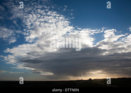 Frontal clouds moving over the sky blocking out the sun at Bawdsey, Suffolk, England Stock Photo