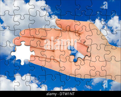 Puzzle hand without one piece Stock Photo