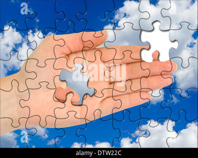 Puzzle hand without one piece Stock Photo