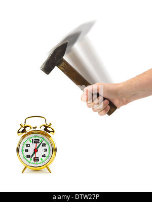 Hand with hammer and alarm clock Stock Photo