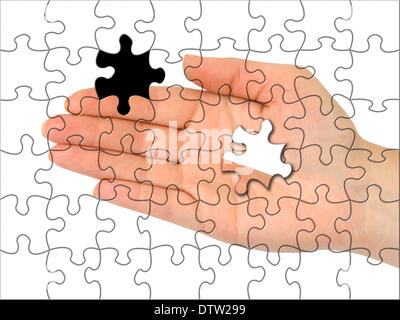 Puzzle hand without one piece Stock Photo