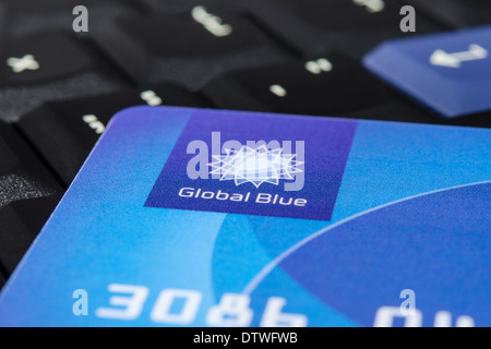 MUNICH, GERMANY - FEBRUAR 20, 2014: Plastic 'Global Blue' card on laptop ThinkPad keyboard. Easy for tax free shopping. Stock Photo