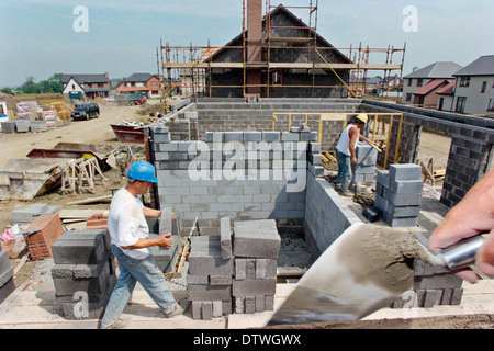 Bricklayers work on the construction of a new house. Stock Photo
