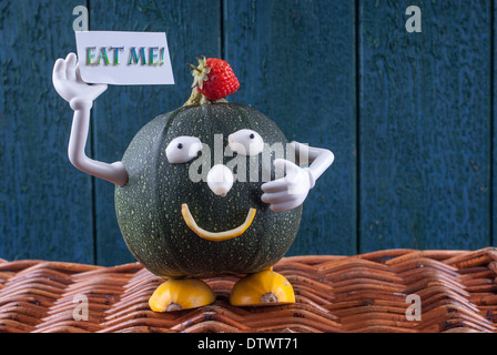 Pumpkin man pulling faces holding a message card Stock Photo