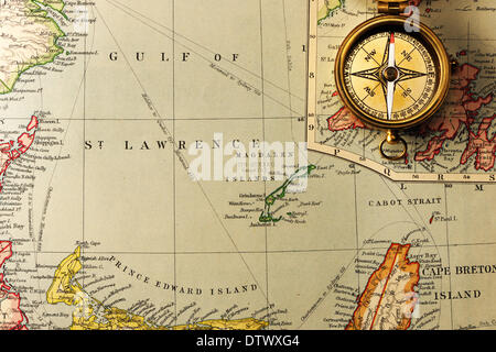 Antique compass over old XIX century map Stock Photo