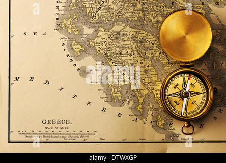 Antique compass over old XIX century map Stock Photo