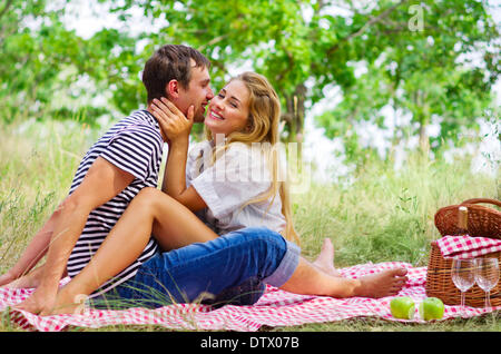 Young couple on picnic at forest Stock Photo