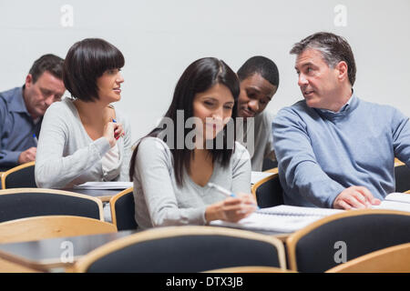 Students talking in lecture Stock Photo
