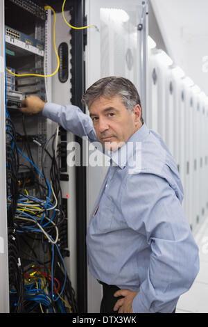 Technician working on data servers Stock Photo