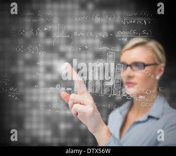 Businesswoman using patterns on touch screen Stock Photo