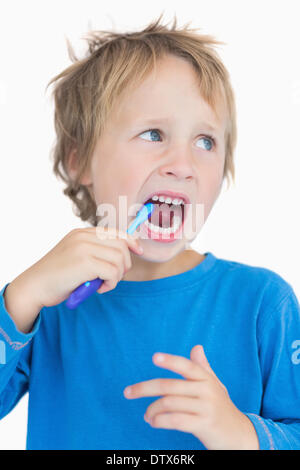 Young boy brushing his teeth Stock Photo