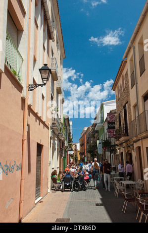 Narrow street in Denia, packed with outside Cafe's. Costa Brava, Spain Stock Photo