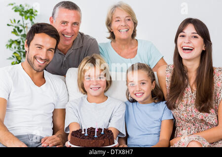 Smiling family with birthday cake Stock Photo