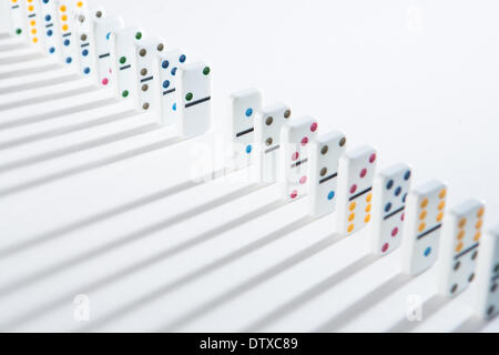 Line of dominoes with one piece missing Stock Photo