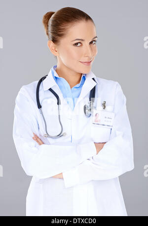 Confident female doctor with crossed arms Stock Photo