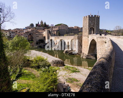 The fortified bridge into Besalu. A fortified stone bridge connects this small medieval village to the outside world Stock Photo