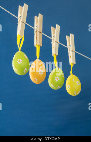 Easter eggs hanging from a washing line Stock Photo