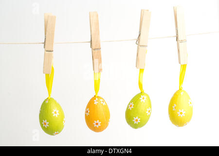 Four easter eggs hanging from a line Stock Photo