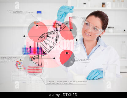 Smiling scientist examining test tube Stock Photo