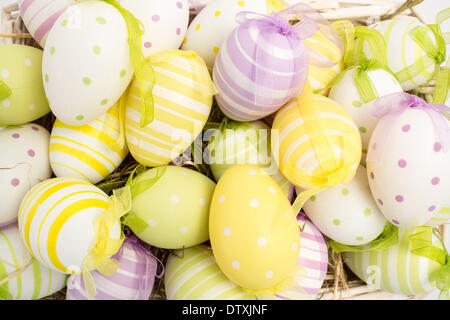 Colourful easter eggs in straw Stock Photo
