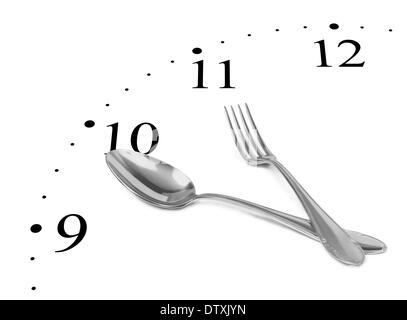 Clock made of fork and spoon Stock Photo