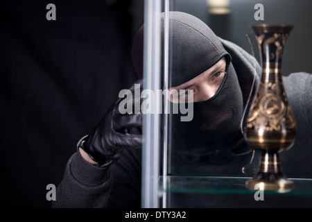 burglar wearing black mask Stock Photo