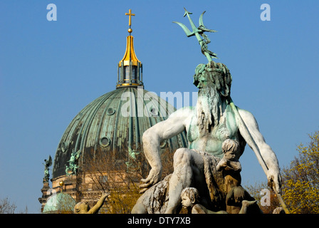 Berlin, Germany. Neptunbrunnen / Neptune Fountain (Reinhold Begas; 1886) in Rathausvorplatz. Berliner Dom / Cathedral behind Stock Photo