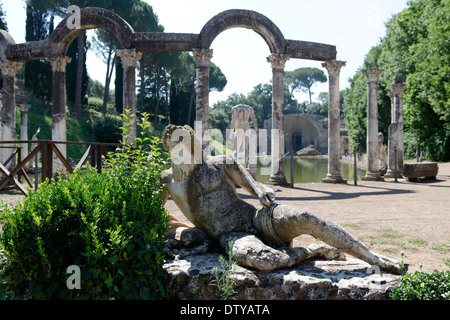 Lounging statue figure at the curved north end of the monumental mystical Canopus Villa Adriana Tivoli Italy The Canopus is a re Stock Photo