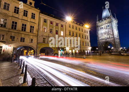 Prague, Czech Republic - July, 15, 2013: Prague illuminated by the night lights near Charles bridge. Some tourists are walking Stock Photo