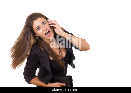 young shocked business woman talking on the phone Stock Photo