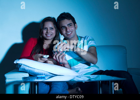 indian couple Home Watching TV Stock Photo