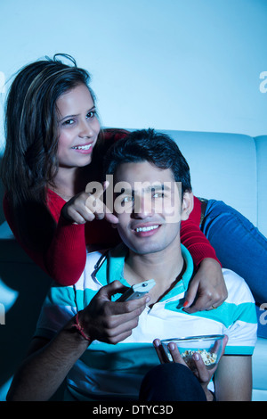 indian couple Home Watching TV Stock Photo