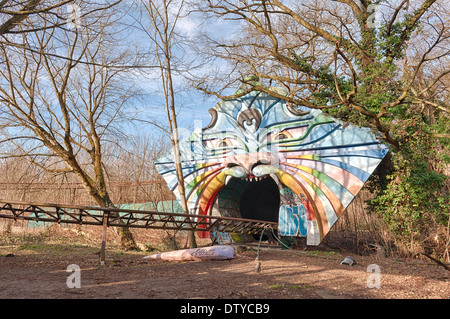 Abandoned derelict recreational forgotten amusement fun park with ruins rides decaying fairground Stock Photo