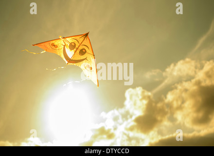 Kite flying in sunny sky Stock Photo