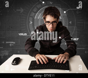 Young hacker in futuristic enviroment hacking personal information Stock Photo