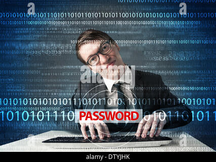 Young geek hacker stealing password Stock Photo