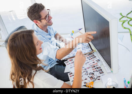 Attractive photo editors working on computer Stock Photo