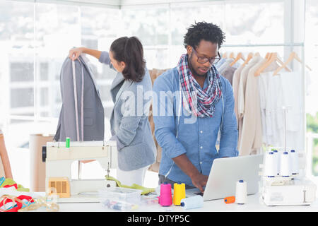 Fashion designer working on laptop Stock Photo