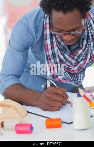 Fashion designer colouring a draw Stock Photo