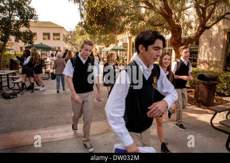 Uniformed students head for class on the campus of a co-educational Catholic private high school in San Juan Capistrano, CA. Stock Photo