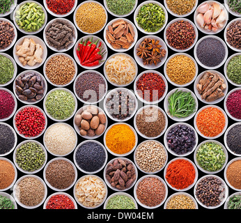 Seamless texture with spices and herbs over black background Stock Photo