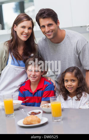 Handsome Man With Juice In Kitchen Stock Photo - Alamy