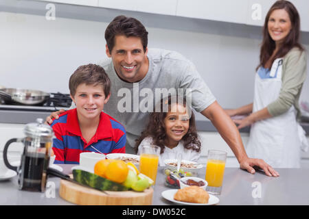 Happy family having breakfast Stock Photo