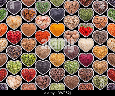 Seamless texture with spices and herbs over black background Stock Photo