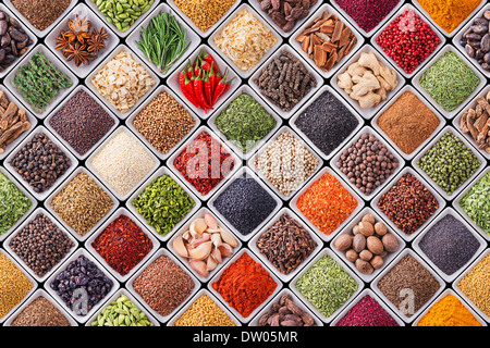 Seamless texture with spices and herbs over black background Stock Photo